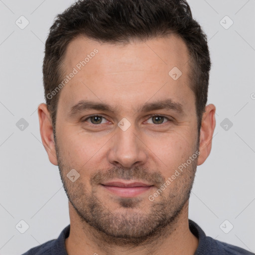 Joyful white adult male with short  brown hair and brown eyes