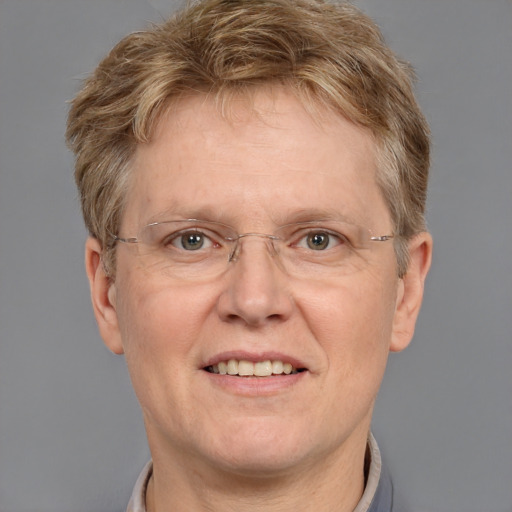 Joyful white middle-aged male with short  brown hair and grey eyes