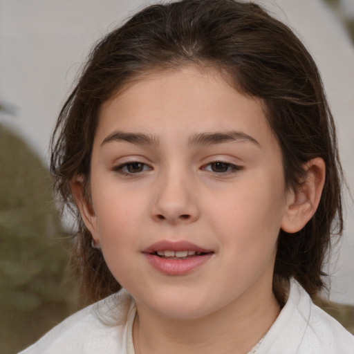 Joyful white child female with medium  brown hair and brown eyes