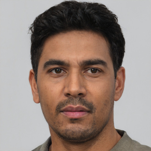 Neutral white young-adult male with short  black hair and brown eyes