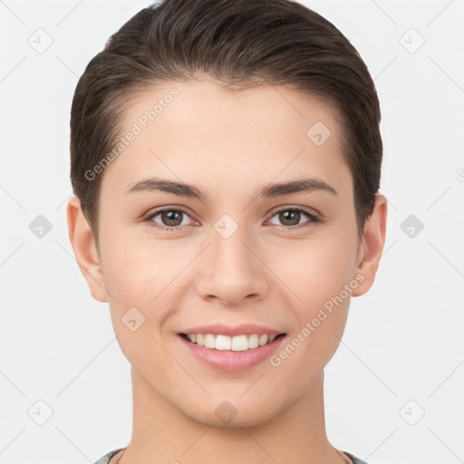 Joyful white young-adult female with short  brown hair and brown eyes