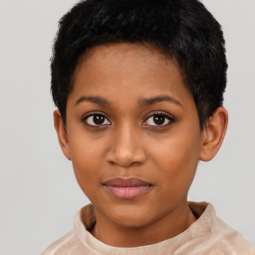 Joyful black young-adult female with short  black hair and brown eyes