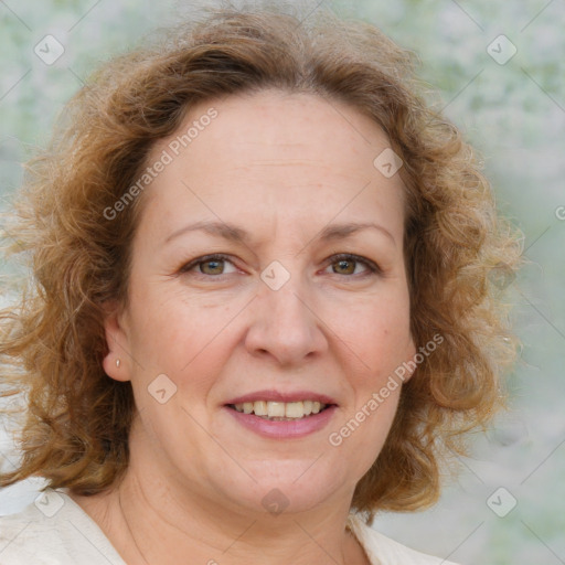 Joyful white adult female with medium  brown hair and blue eyes