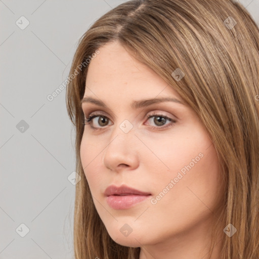 Neutral white young-adult female with long  brown hair and brown eyes