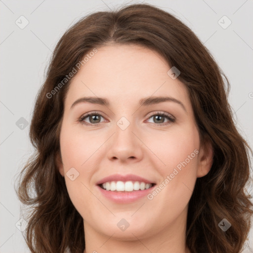 Joyful white young-adult female with long  brown hair and green eyes