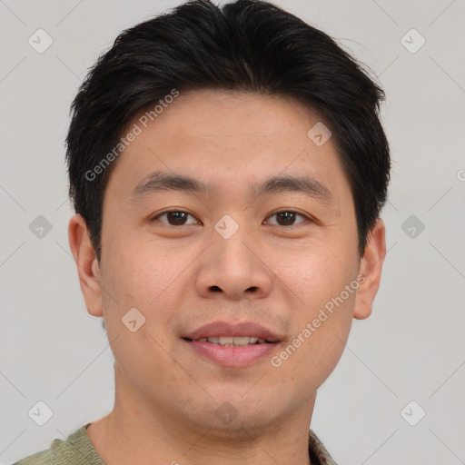 Joyful asian young-adult male with short  brown hair and brown eyes