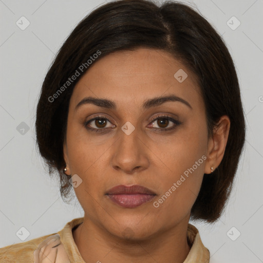 Joyful latino young-adult female with medium  brown hair and brown eyes