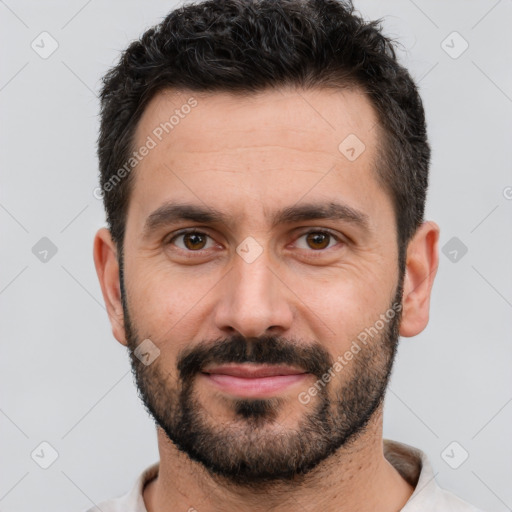 Joyful white young-adult male with short  black hair and brown eyes