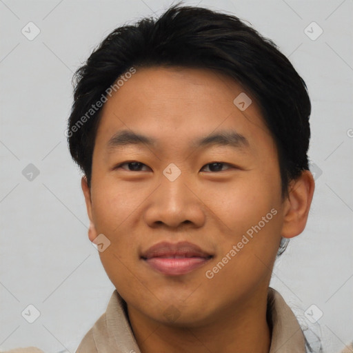 Joyful asian young-adult male with short  black hair and brown eyes