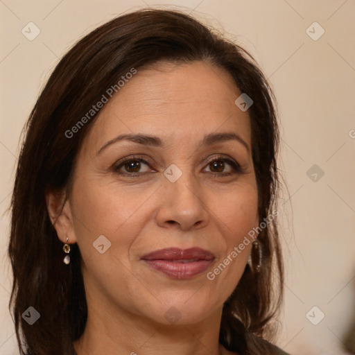 Joyful white adult female with long  brown hair and brown eyes