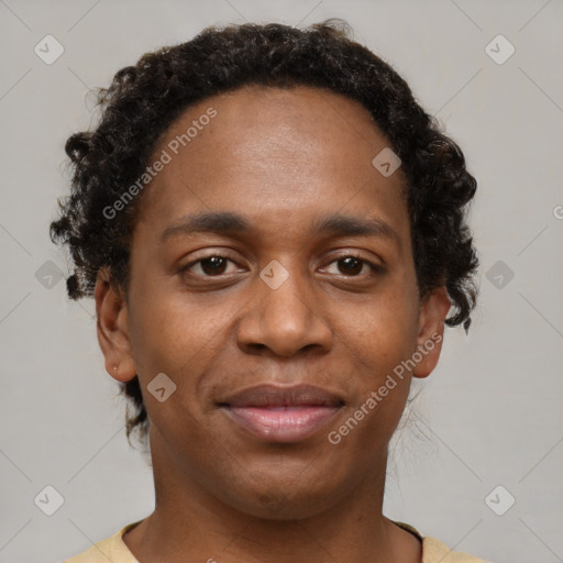 Joyful black young-adult male with short  brown hair and brown eyes