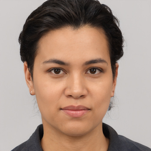 Joyful asian young-adult female with medium  brown hair and brown eyes