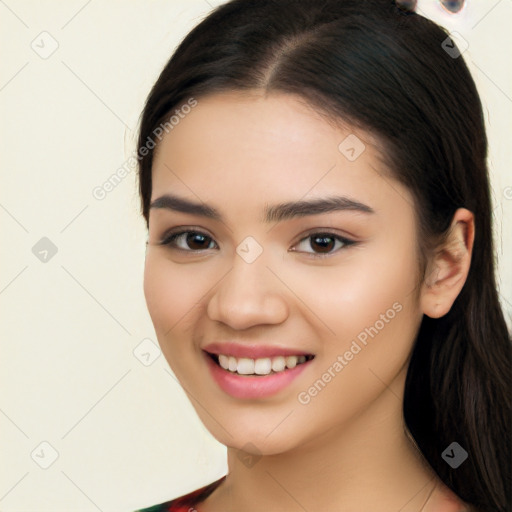 Joyful white young-adult female with long  black hair and brown eyes