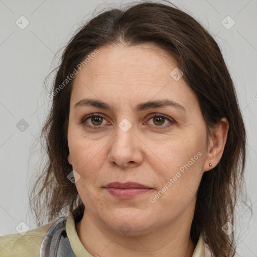 Joyful white adult female with medium  brown hair and brown eyes