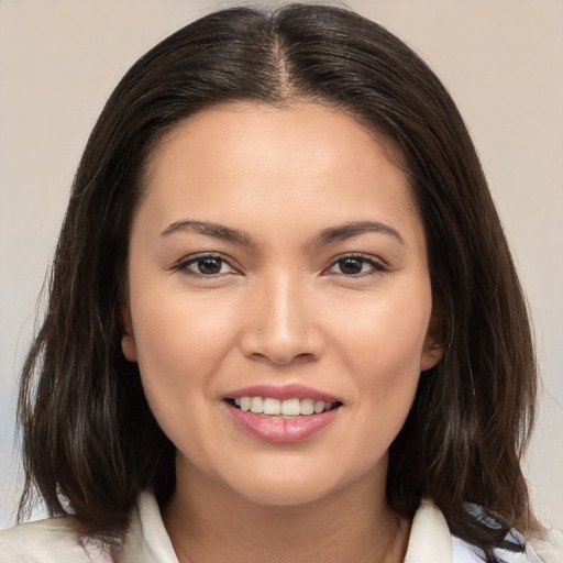 Joyful white young-adult female with medium  brown hair and brown eyes