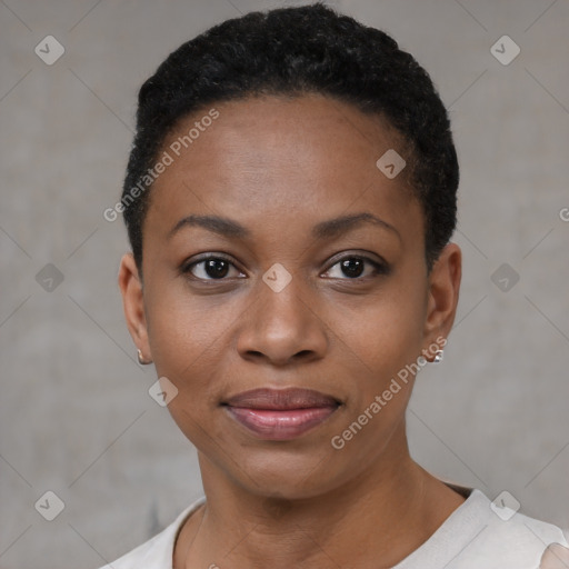 Joyful black young-adult female with short  black hair and brown eyes