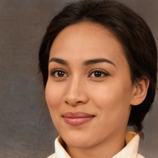 Joyful asian young-adult female with medium  brown hair and brown eyes