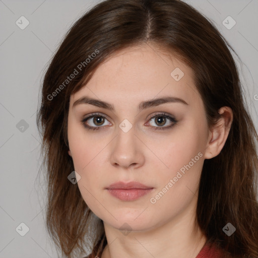 Neutral white young-adult female with long  brown hair and brown eyes