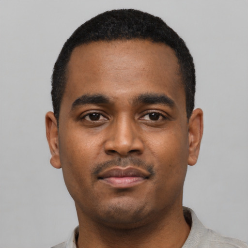 Neutral black young-adult male with short  black hair and brown eyes