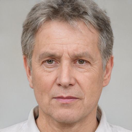 Neutral white middle-aged male with short  gray hair and brown eyes