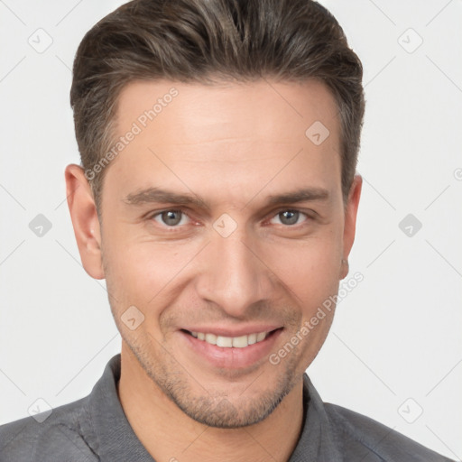 Joyful white young-adult male with short  brown hair and brown eyes