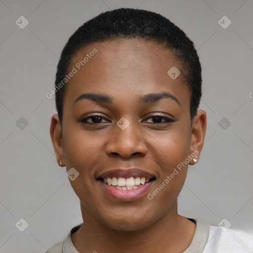 Joyful black young-adult female with short  black hair and brown eyes