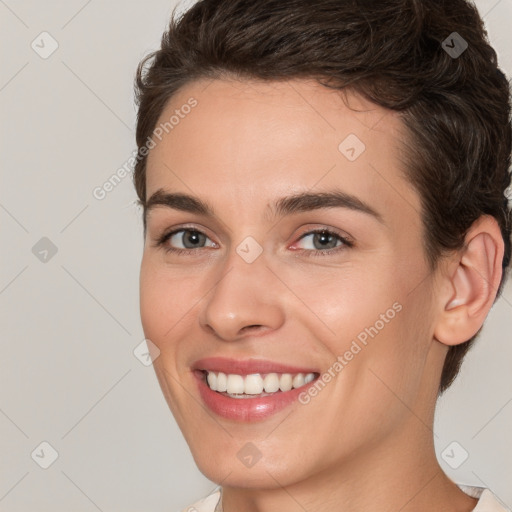 Joyful white young-adult female with short  brown hair and brown eyes