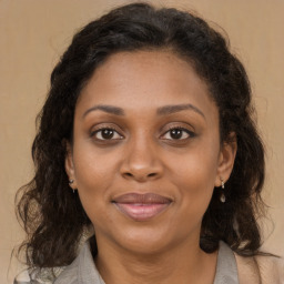 Joyful latino adult female with medium  brown hair and brown eyes