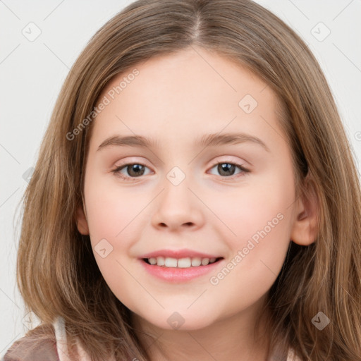 Joyful white child female with long  brown hair and brown eyes