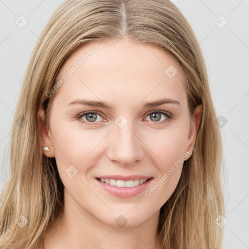 Joyful white young-adult female with long  brown hair and blue eyes