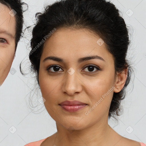 Joyful latino young-adult female with medium  brown hair and brown eyes