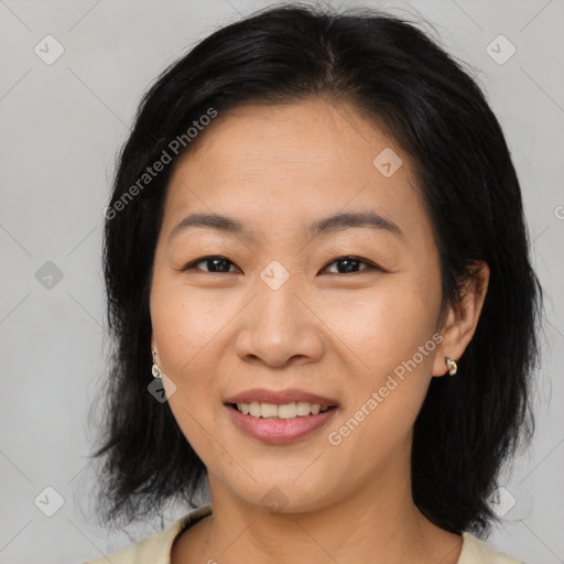 Joyful asian young-adult female with medium  brown hair and brown eyes