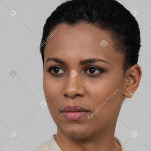 Joyful latino young-adult female with short  black hair and brown eyes