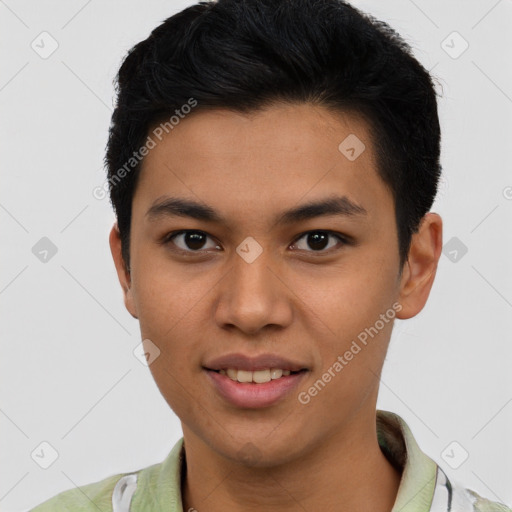 Joyful latino young-adult male with short  black hair and brown eyes