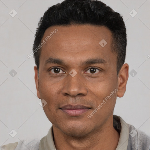 Joyful latino adult male with short  black hair and brown eyes