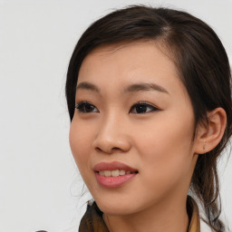 Joyful asian young-adult female with long  brown hair and brown eyes