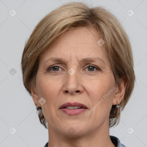 Joyful white adult female with medium  brown hair and grey eyes