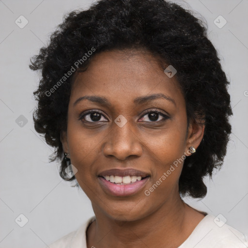 Joyful black young-adult female with medium  black hair and brown eyes