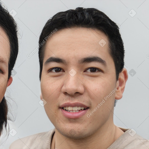 Joyful asian young-adult male with short  black hair and brown eyes