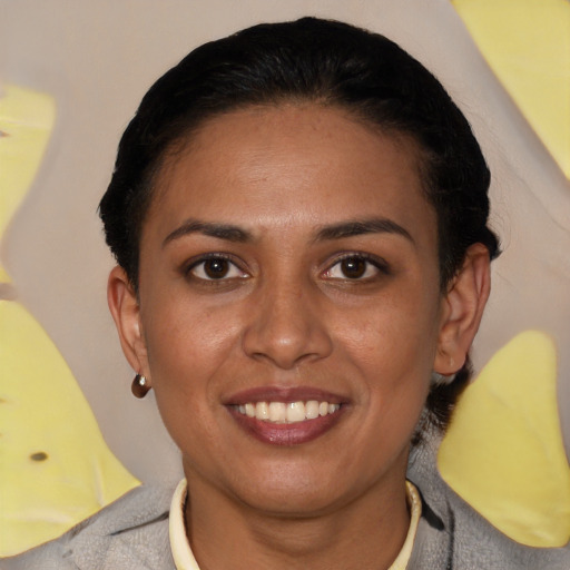 Joyful latino young-adult female with short  brown hair and brown eyes