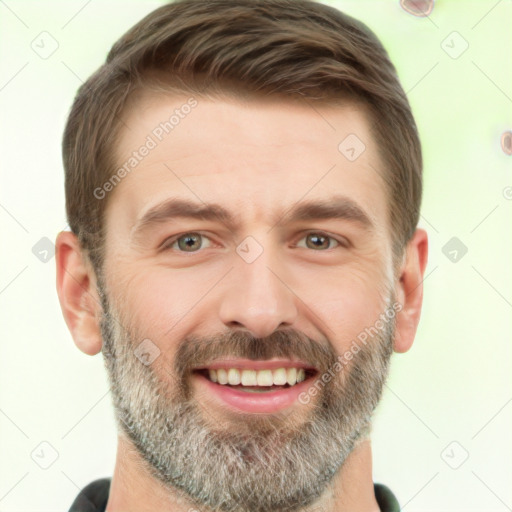 Joyful white adult male with short  brown hair and brown eyes