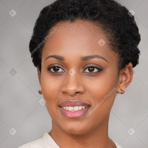 Joyful black young-adult female with short  brown hair and brown eyes