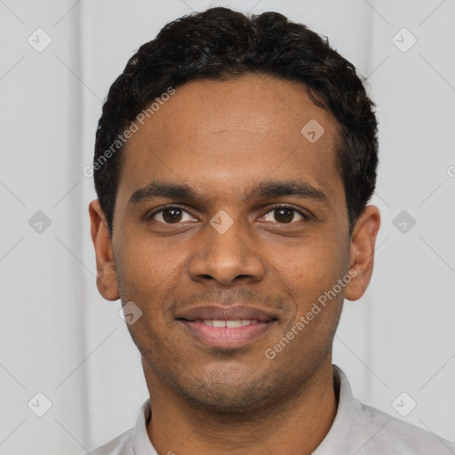 Joyful black young-adult male with short  black hair and brown eyes