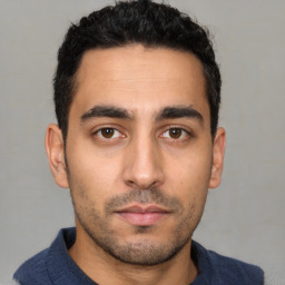 Neutral latino young-adult male with short  black hair and brown eyes