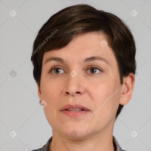 Joyful white adult female with short  brown hair and brown eyes