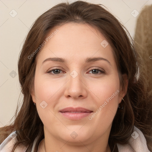 Joyful white adult female with long  brown hair and brown eyes