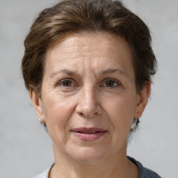 Joyful white adult female with short  brown hair and brown eyes