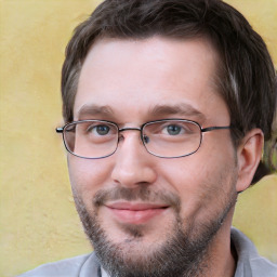 Joyful white adult male with short  brown hair and brown eyes