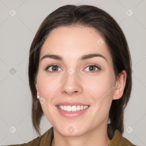 Joyful white young-adult female with medium  brown hair and brown eyes