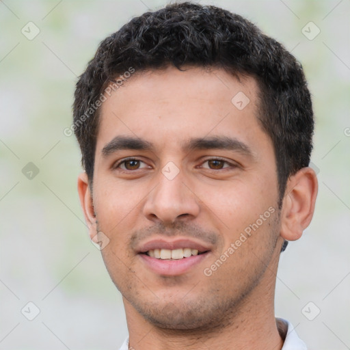 Joyful white young-adult male with short  black hair and brown eyes